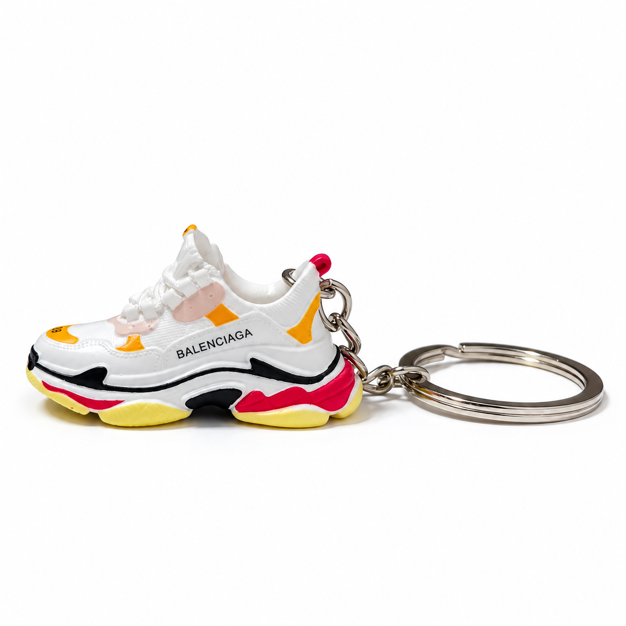 Mini sneaker Balenciaga Triple S vista lateral