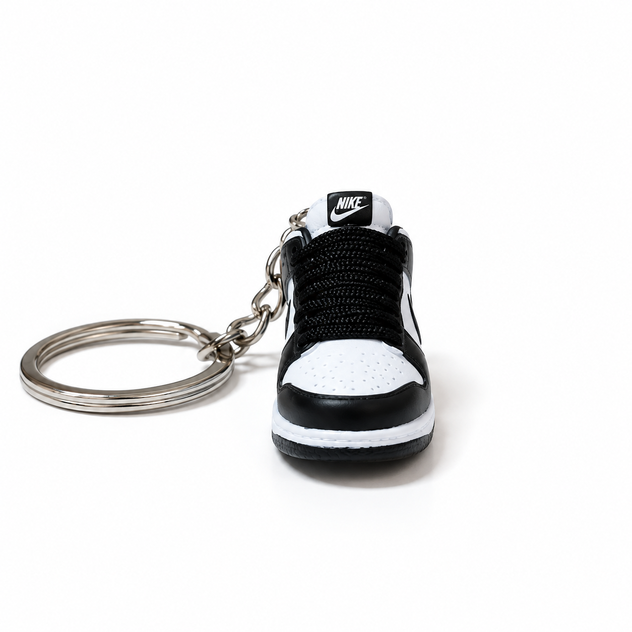 Mini sneaker Nike Dunk Low Panda vista frontal